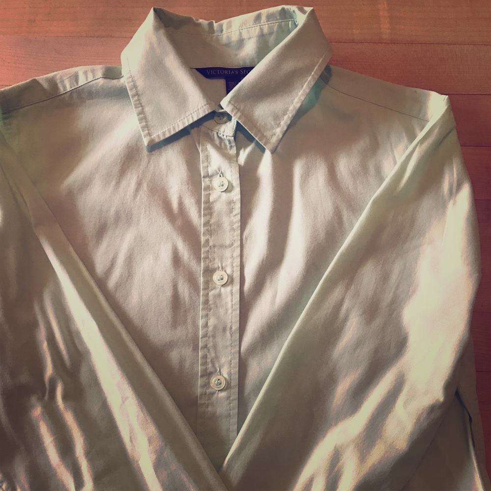 Mint green button down shirt.